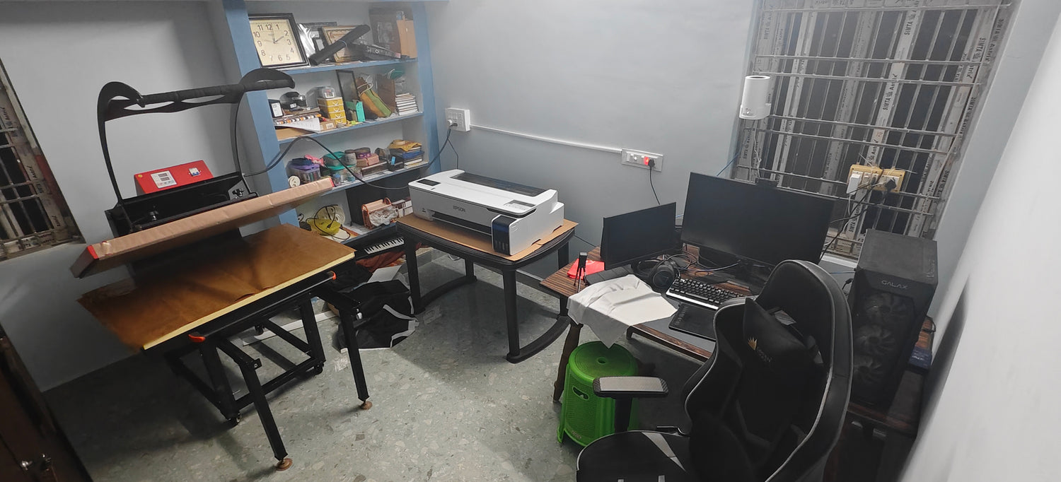 Home office with computer setup, desk, and shelves.